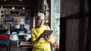 Woman reading Northwestern Mutual Market Commentary